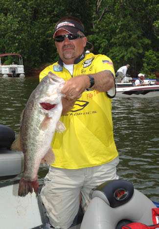 Charlie Sipe holds the 9 lb., 2 oz. bass that won Purolator Big Bass of the Tournament honors for him. He caught the fish on a jig.