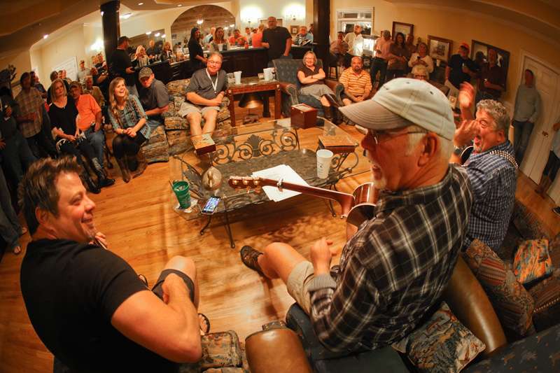 Donnie Lowery hams it up with his fellow song writers. 