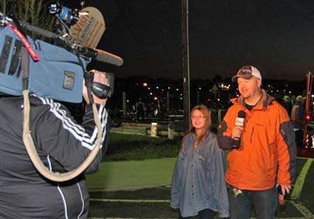 A Fox sports reporter does a live broadcast from the launch.