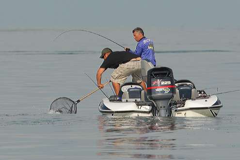 <p>
	Brian Metry catches one and his co-angler helps net the fish.</p>
