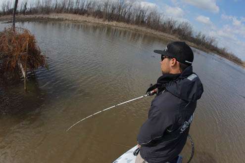 <p>
	Palaniuk pitches a lure near one of the many duck blinds on the Red River.</p>
