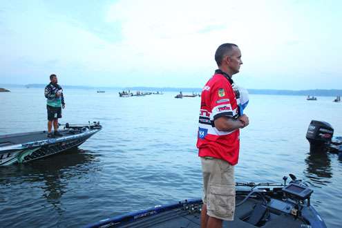 <p>
	Marty Robinson and Chris Lane listen as the national anthem plays.</p>
