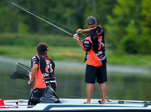 Flurry sweeps his rod to set the hook on another bass. 