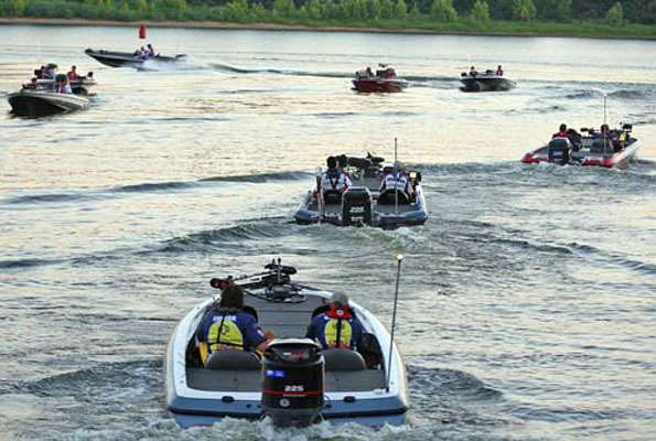 Boats idle toward the Arkansas River Wednesday.
