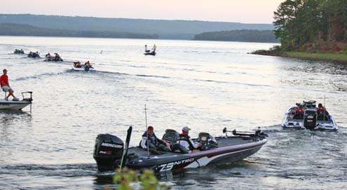 <p>
	A line of boats heads out toward Lake Maumelle.</p>
