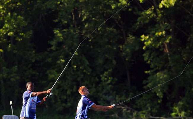 Kyle Gates and Daniel Butler make synchronized casts. The team is from St. Ambrose University in Davenport, Iowa. 
