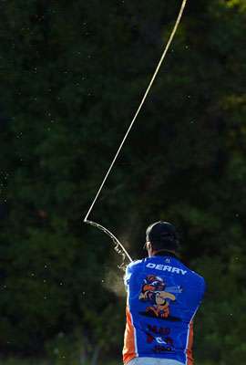 Derry fires a cast into the bright morning sun. 