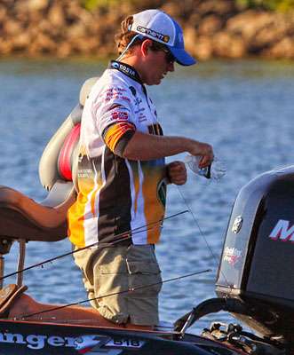 Dalton Darnell from Auburn University-Montgomery reels line around a marker buoy fashioned from an empty water bottle. 