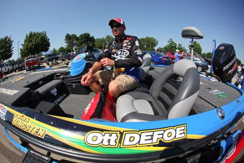 <p>
	Ott Defoe gets ready to weigh his catch for the day. </p>
