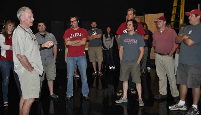 <p>
	Jerry McKinnis entertains staff members as he prepares to introduce the national champs for a meet-and-greet.</p>
