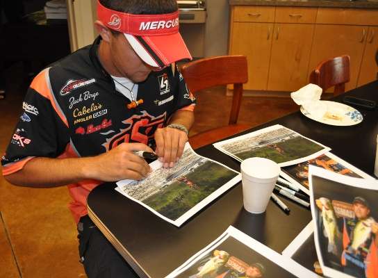 <p>
	Zack Birge stayed busy signing photos of himself and Flurry on the water.</p>
