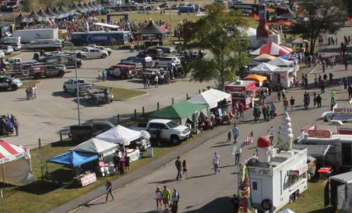 <p>From atop a nearby Ferris Wheel, people continue to walk into the weigh-in area after the event had started.</p>
