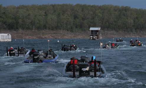 Boats line up and idle out of the Bull Shoals Dock area.