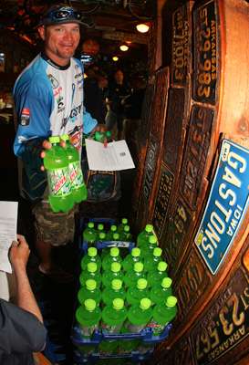 <p>Hank Cherry grabs a couple Diet Mountain Dews to put in his boat. </p>