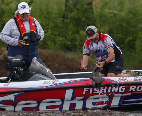 <p>Now he got it.  His Marshall looks on as Elias pulls it over the rail.</p>
