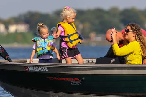 Families are on the water enjoying the day.