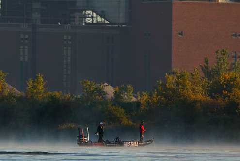 John Crews fishes near downtown Muskegon, MI.