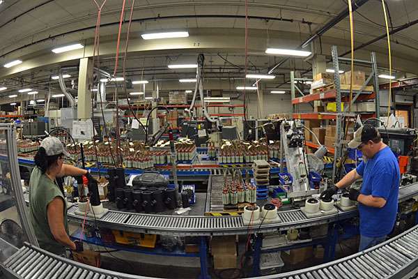 These workers are attaching the bulk of the head onto the front bit or a Fortrex, which holds the transducer. Each and every unit is tested before it leaves the plant.