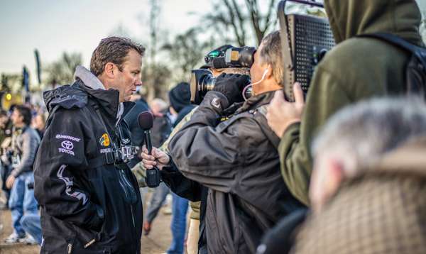 A crowd of media interviews Kevin VanDam.