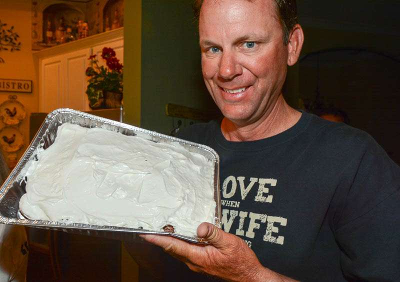 Kevin shows off his mother's chocolate cake with homemade marshmallow frosting. Kevin may not be the most talented member of his family. 