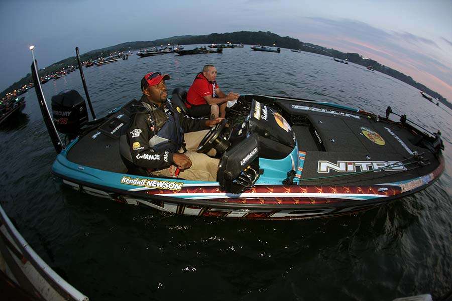 Former Miami Dolphin pro Kendall Newson idles his boat through the checkout line. 