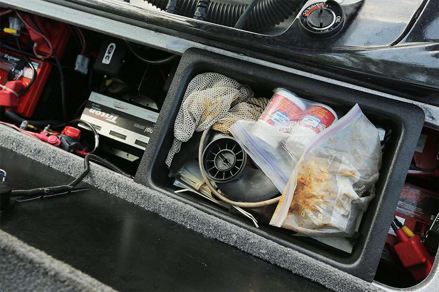 In the battery box is a small tray where Grigsby keep two spare trolling motor props, zip ties and other necessities. 