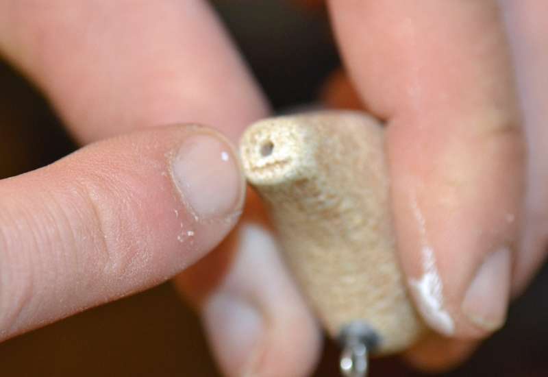 Before the lip slot of cut, a hole is drilled for the rear hook hanger.