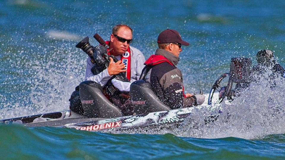 Or bear-hugging his camera as the boat moved through crashing waves.