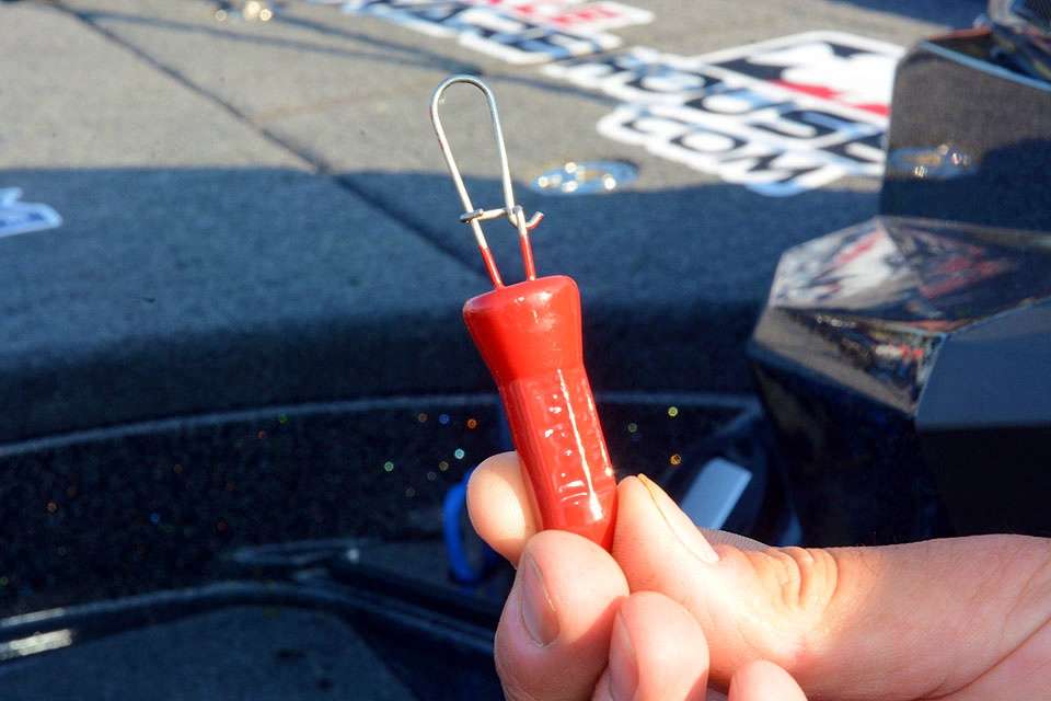 This is the Woo Daves Pocket Knocker Lure Retriever. Simply snap it on the line, drop it down to the lure and give it a shake to free the bait.