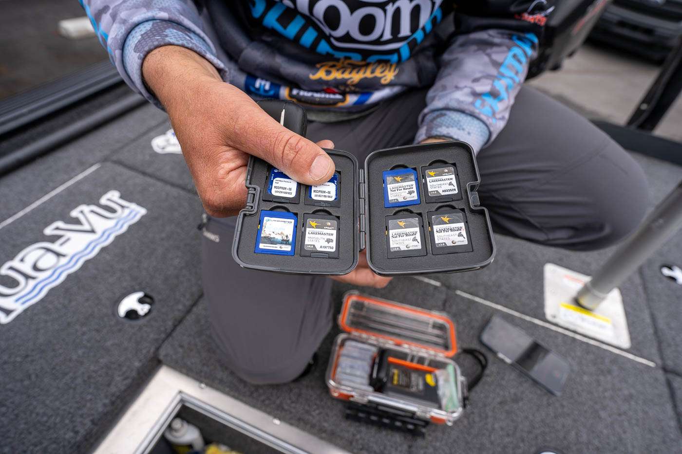 Lakemaster cards for the whole country. He keeps them in a Plano dry box. 