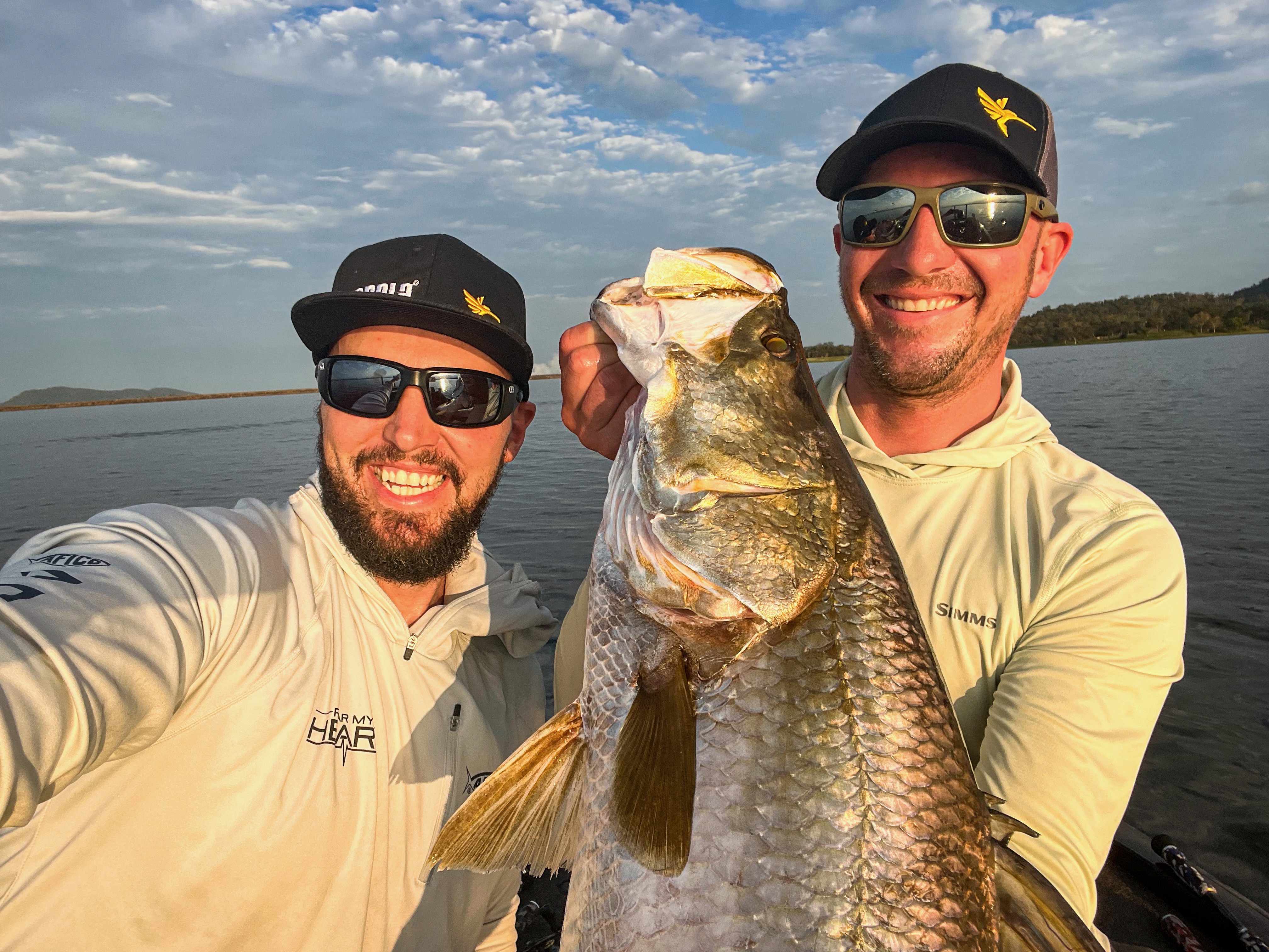 Jeff Gustafson and Carl Jocumsen hold an Australian Barramundi.