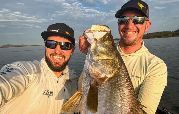 Jeff Gustafson and Carl Jocumsen hold an Australian Barramundi.