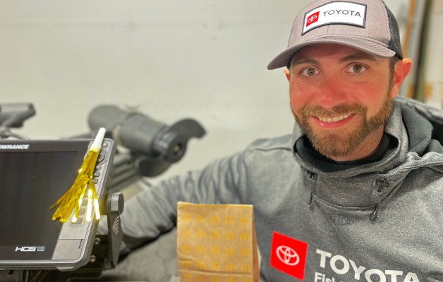 Brandon Lester holds up a fast-food bag